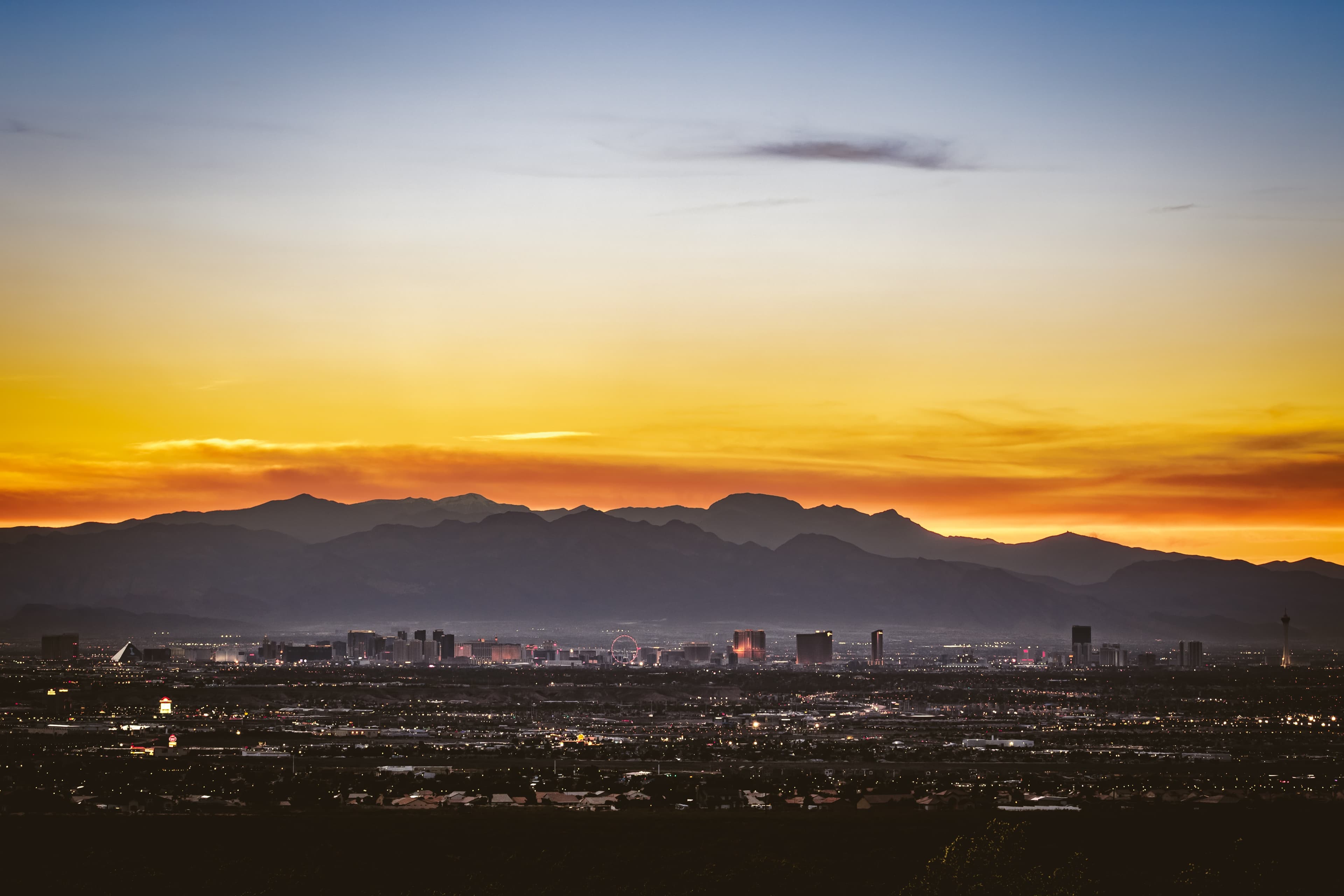 This is a view of Las Vegas with mountains behind the Las Vegas Strip.